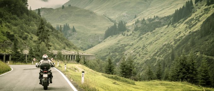 [img] Motorcyclist on mountainous highway
